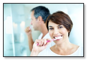 happy dental implant brushing your teeth